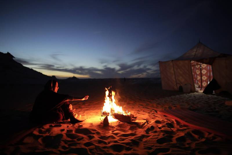 Tourists camp near white inselbergs in Egypt's White Desert. EPA