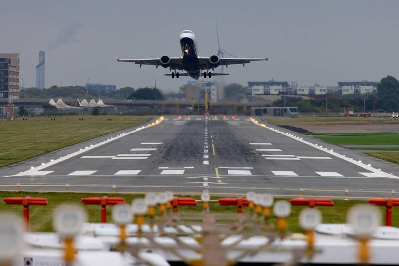 A British Airways aircraft takes off from London City Airport. The airline is among 60 companies pledging to use more sustainable fuel. Bloomberg