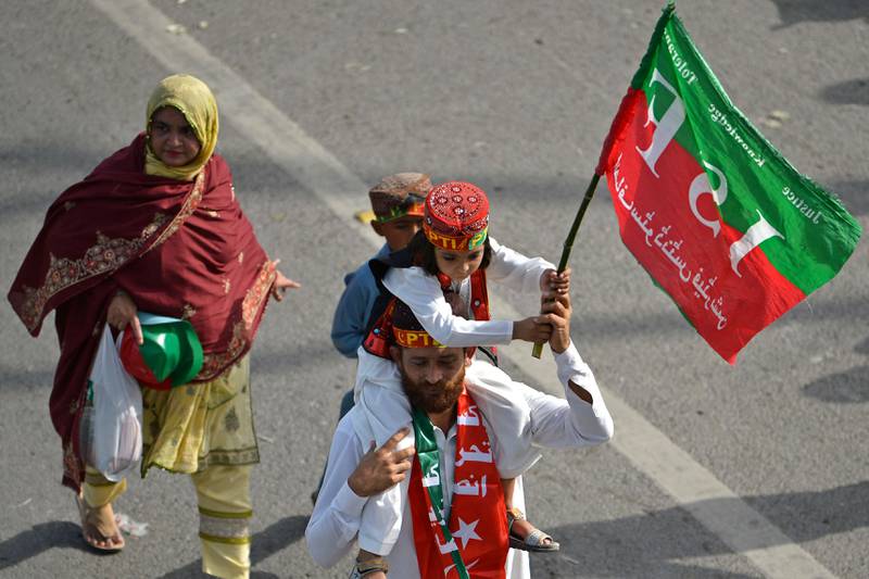 A family arrives to attend a rally in Islamabad. AFP