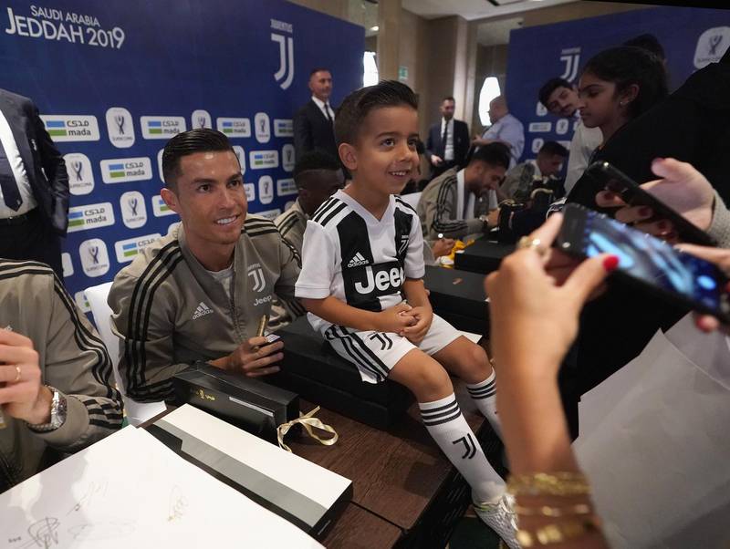 Cristiano Ronaldo of Juventus signing autographs during a meet and greet in Jeddah. Getty Images