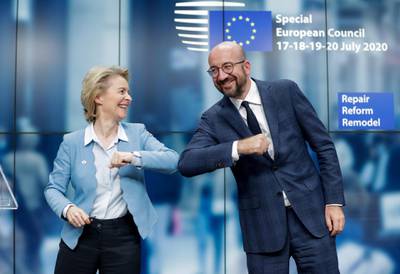 European Council President Charles Michel and European Commission President Ursula Von Der Leyen do an elbow bump at the end of a news conference following a four-day European summit at the European Council in Brussels, Belgium, July 21, 2020. Stephanie Lecocq/Pool via REUTERS     TPX IMAGES OF THE DAY