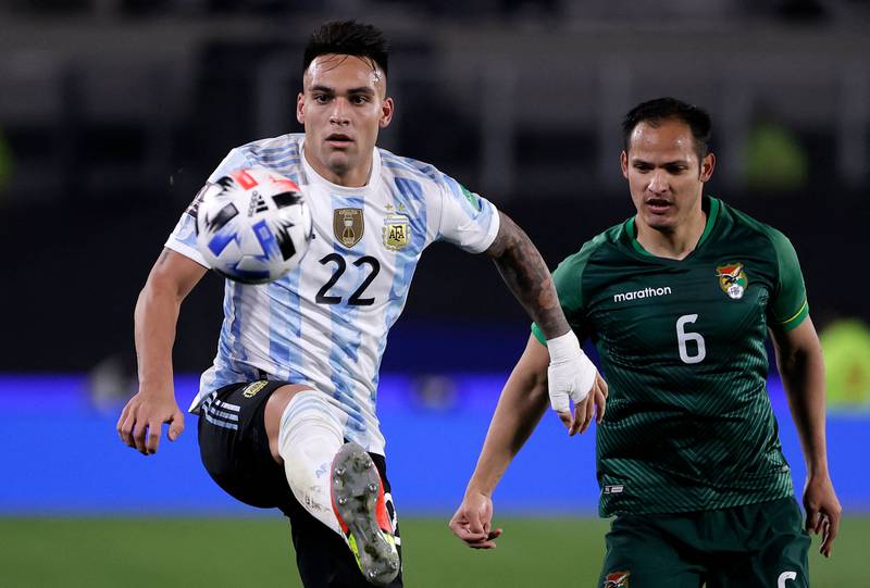 Argentina's Lautaro Martinez watched by Leonel Justiniano of Bolivia. AFP