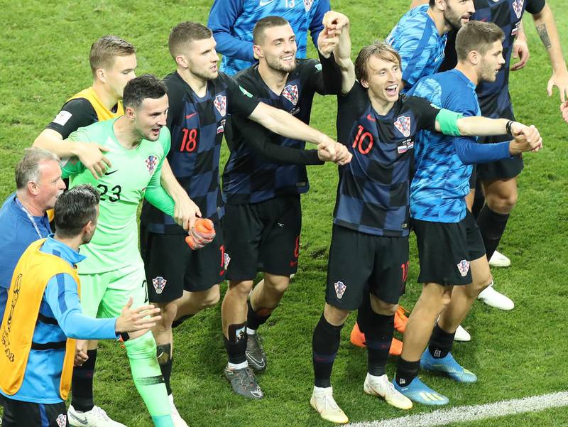 epa06872802 Luka Modric  (2-R) of Croatia celebrates after the FIFA World Cup 2018 quarter final soccer match between Russia and Croatia in Sochi, Russia, 07 July 2018. Croatia won on penalties 4-3.

(RESTRICTIONS APPLY: Editorial Use Only, not used in association with any commercial entity - Images must not be used in any form of alert service or push service of any kind including via mobile alert services, downloads to mobile devices or MMS messaging - Images must appear as still images and must not emulate match action video footage - No alteration is made to, and no text or image is superimposed over, any published image which: (a) intentionally obscures or removes a sponsor identification image; or (b) adds or overlays the commercial identification of any third party which is not officially associated with the FIFA World Cup)  EPA/KHALED ELFIQI   EDITORIAL USE ONLY
