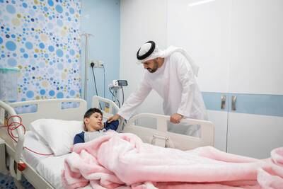 Sheikh Theyab bin Mohamed, Chairman of the Office of Development and Martyrs' Families Affairs at the Presidential Court, visiting injured Palestinian children and their families at UAE hospitals on Tuesday. All photos: Abu Dhabi Media