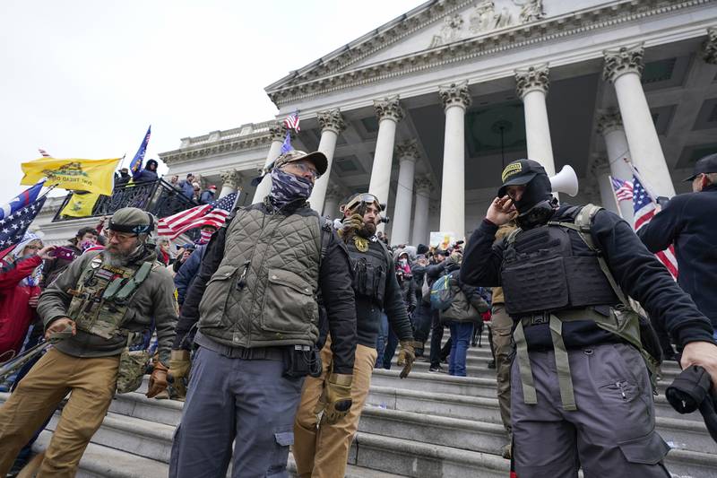 Members of Oath Keepers stand in front of the US Capitol on January 6, 2021. AP