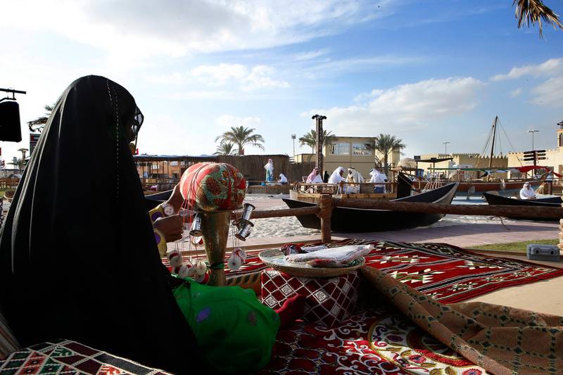 ABU DHABI - UNITED ARAB EMIRATES - 10 DEC 2016 - A elderly women showing her "Al Talli" skills to the visitors yesterday at the Sheikh Zayed Heritage Festival in Al Wathba in Abu Dhabi. Ravindranath K / The National (Standalone for News) ID: 14488  *** Local Caption ***  RK1012-StreetFeast05.jpg