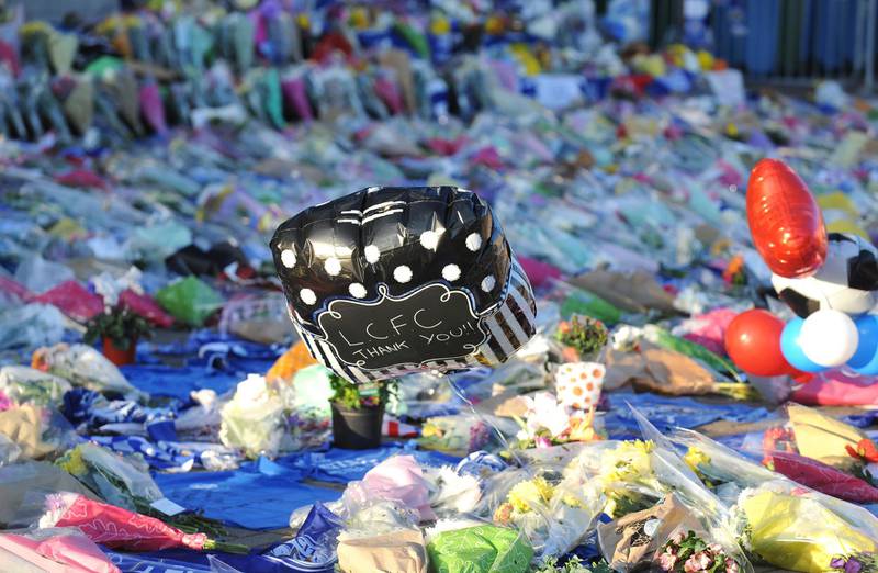 Tributes are placed outside Leicester City Football Club. AP Photo
