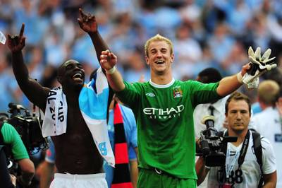 LONDON, ENGLAND - MAY 14: Joe Hart the Manchester City goalkeeper and team mate Micah Richards celebrate following their victory during the FA Cup sponsored by E.ON Final match between Manchester City and Stoke City at Wembley Stadium on May 14, 2011 in London, England. (Photo by Shaun Botterill/Getty Images)