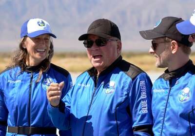 William Shatner, center, speaks as Audrey Powers, left, and Chris Boshuizen appear during a press opportunity at the Blue Origin spaceport near Van Horn, Texas, on October 13, 2021. The "Star Trek" actor and the three fellow passengers soared to an altitude of 107 kilometres over the West Texas desert near Van Horn in a fully automated capsule, in a flight that lasted just over 10 minutes. AP