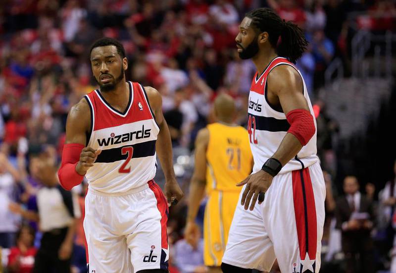 John Wall, left, of the Washington Wizards celebrates after scoring against the Indiana Pacers. Rob Carr / Getty Images