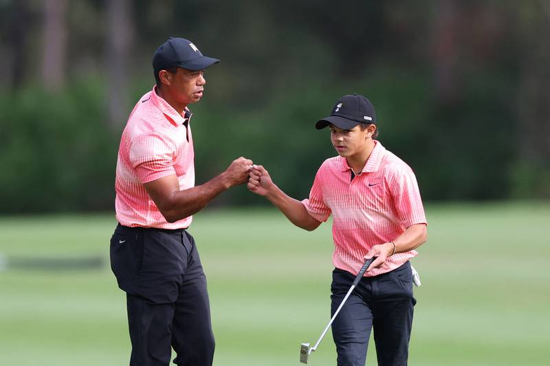 Tiger Woods and Charlie Woods on the sixth green during the first round of the PNC Championship. AFP