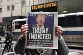 Former US president Donald Trump on the front page of a New York newspaper after he is charged by a Manhattan grand jury. Reuters