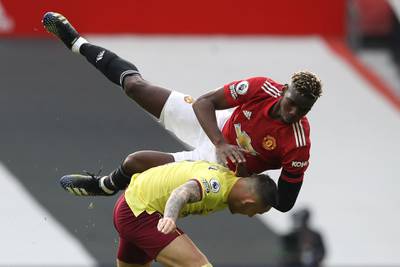 Manchester United's Paul Pogba tangles with Josh Brownhill of Burnley. Reuters