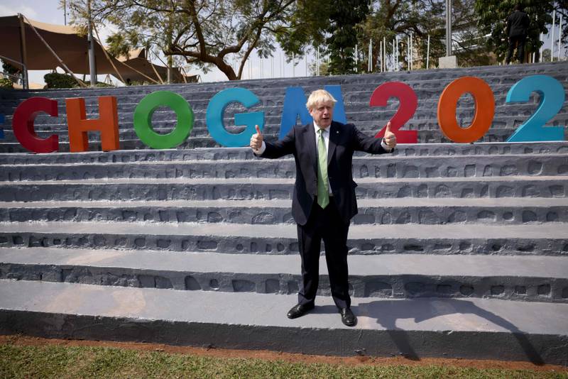 Britain's Prime Minister Boris Johnson poses as he attends a Commonwealth Business Forum Exhibition at The Kigali Cultural Village, during the Commonwealth Heads of Government Meeting. AFP
