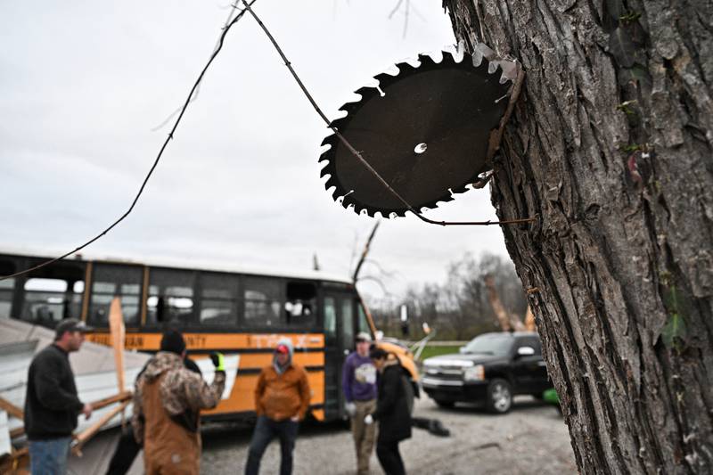 A saw blade is embedded in a tree after the tornado in Sullivan. Reuters