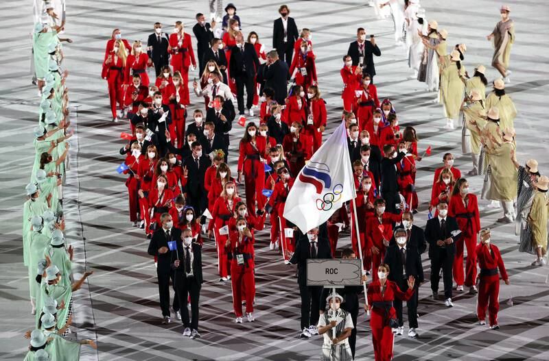 Flag Bearers of the Russian Olympic Committee (ROC) team Sofya Velikaya and  Maxim Mikhaylov lead a delegation.