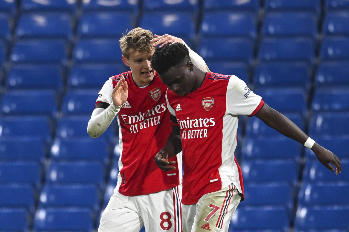 Bukayo Saka celebrates after scoring Arsenal's fourth goal with Martin Odegaard. EPA