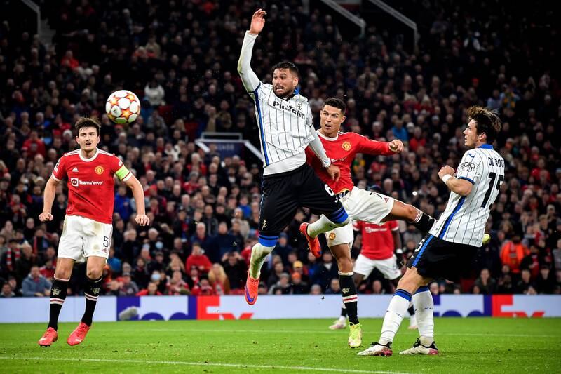 Manchester United's Cristiano Ronaldo scores during the  Champions League match against Atalanta at Old Trafford in October 2021.   EPA