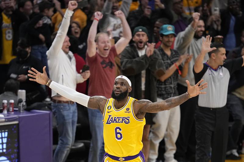 LeBron James celebrates after overtaking Kareem Abdul-Jabbar as the NBA's all-time leading scorer. AP