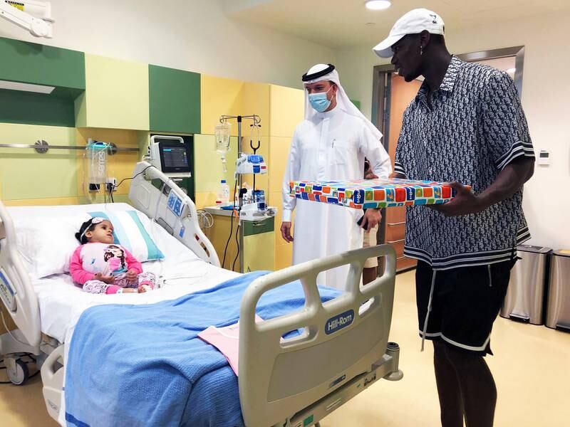 Pogba tours the hospital's wards and rooms.
