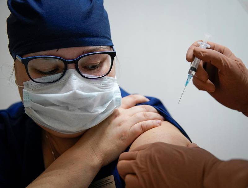A medic of the regional hospital receives  Russia's "Sputnik-V" vaccine shot against the coronavirus disease (COVID-19) in Tver, Russia October 12, 2020.  REUTERS/Tatyana Makeyeva