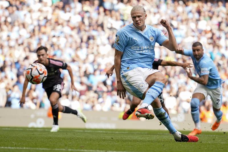Erling Haaland scores Manchester City's fourth goal from penalty spot against Fulham at the Etihad Stadium. AP