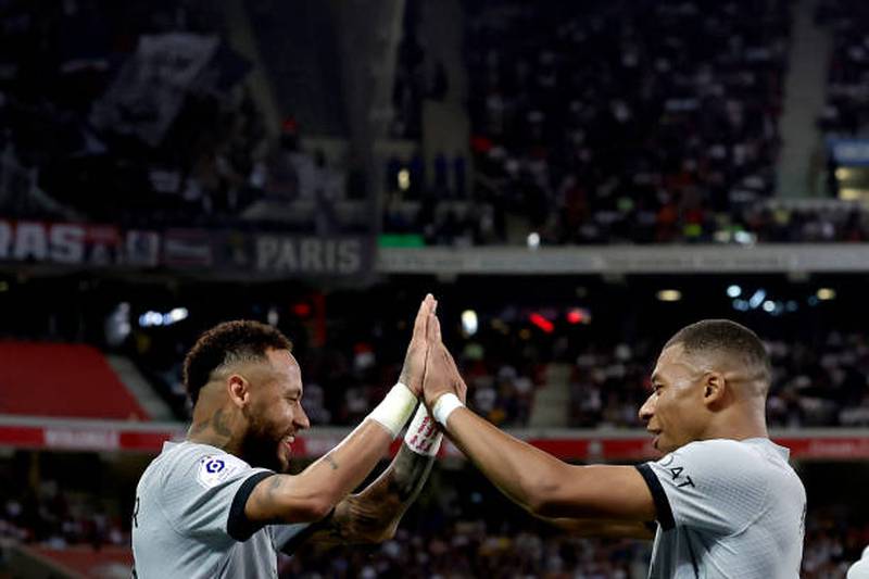 Neymar of Paris Saint-Germain and Kylian Mbappe celebrate. Getty Images