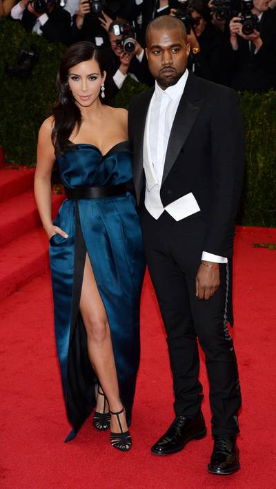 epa04192888 US socialite Kim Kardashian (L) and US singer Kanye West (R) arrive for the 2014 Anna Wintour Costume Center Gala held at the New York Metropolitan Museum of Art in New York, New York, USA, 05 May 2014. The Costume Institute's new Anna Wintour Costume Center opens on 08 May with the exhibition 'Charles James: Beyond Fashion.'  EPA/JUSTIN LANE