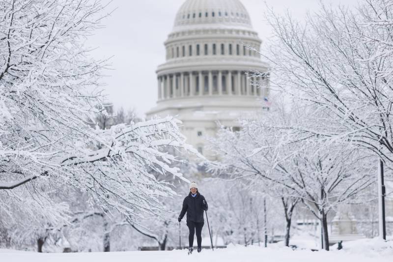 A resident uses cross-country skis outside the US  Capitol building. Bloomberg