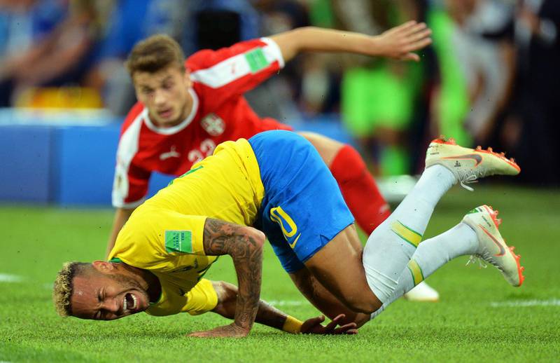 Neymar on a roll after being brought down during Brazil's match against Serbia. Peter Powell / EPA