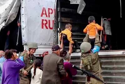 Russian peacekeepers evacuate Nagorno-Karabakh civilians at an undisclosed location. AFP