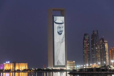 An image of Sheikh Khalifa is projected on to a building in Abu Dhabi. Antonie Robertson / The National