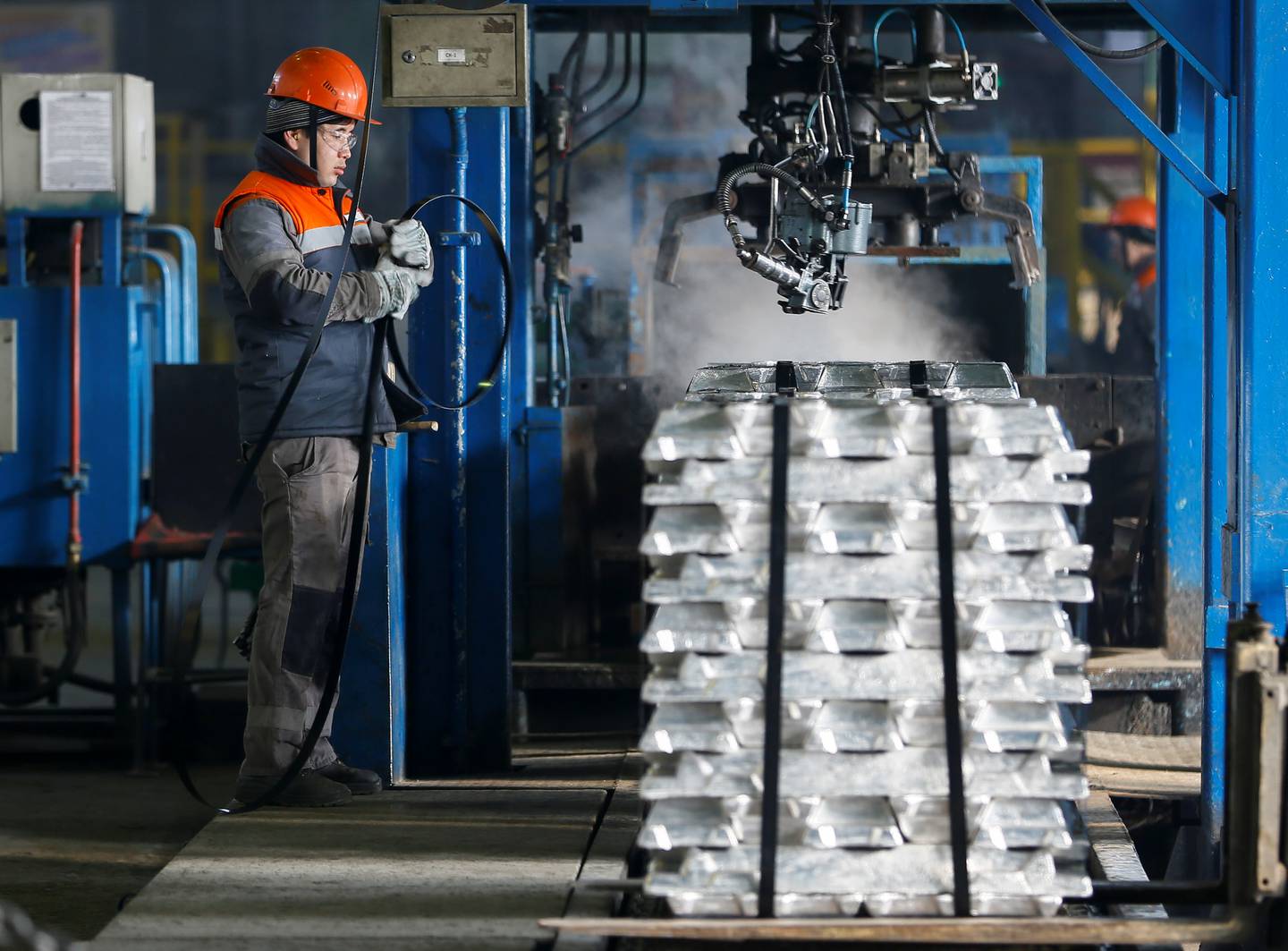 A worker packs aluminium bars at Kazakh mining company Eurasian Resources Group's (ERG) Kazakhstan Aluminium Smelter JSC (KAS) factory in Pavlodar, Kazakhstan February 20, 2018. Picture taken February 20, 2018. REUTERS/Shamil Zhumatov