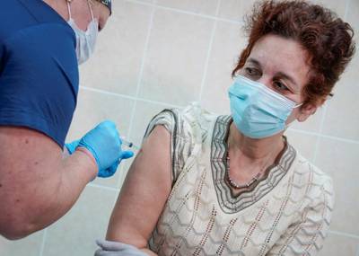 A nurse inoculates a volunteer with Sputnik-V at a clinic in Moscow on September 17. Reuters