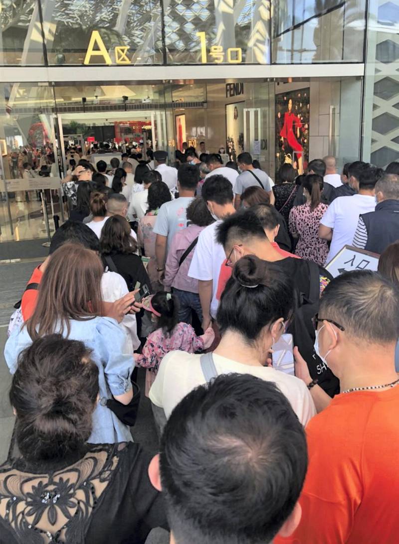 People queue in Sana, on China's Hainan Island. A large number of travellers from across the country have arrived in the city for Chinese New Year. The Moodie Davitt Report