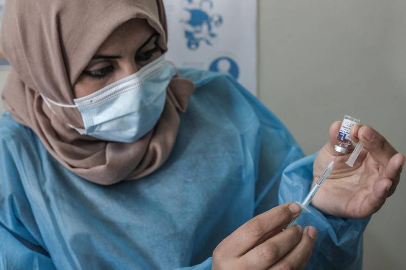 A health worker prepares an injection of the Sputnik V Covid-19 vaccine at Sabha Al-Harazin Clinic in Gaza City. Getty Images