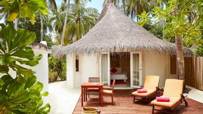 A beach villa at Sun Siyam Vilu Reef, where stays cost from $245 per night.