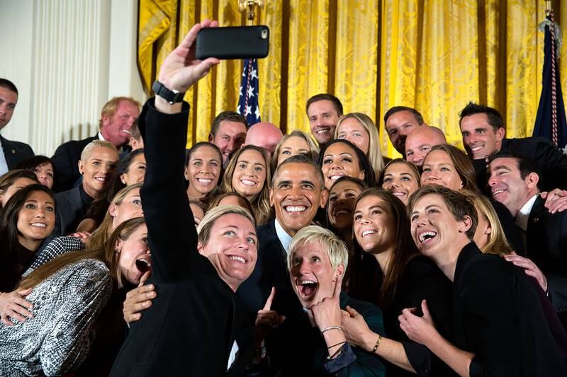 Mr Obama poses for a group selfie with the US Women's National Soccer Team celebrating their Fifa Women's World Cup victory at the White House on October 27, 2015. Photo: The National Archives