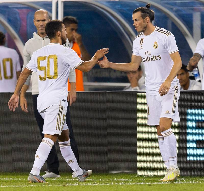 epa07743370 Gareth Bale (R) of Real Madrid shakes hands with teammate Eden Hazard (L) as he comes into the game during the second half of the International Champions Cup (ICC) soccer match between Real Madrid and Atletico de Madrid at MetLife Stadium in East Rutherford, New Jersey, USA, 26 July 2019.  EPA/JUSTIN LANE
