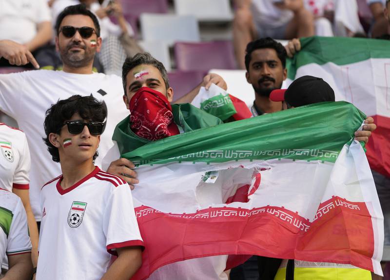 Iranian football fans enjoy the build-up to the World Cup match between England and Iran at the Khalifa International Stadium in Doha on Monday. AP