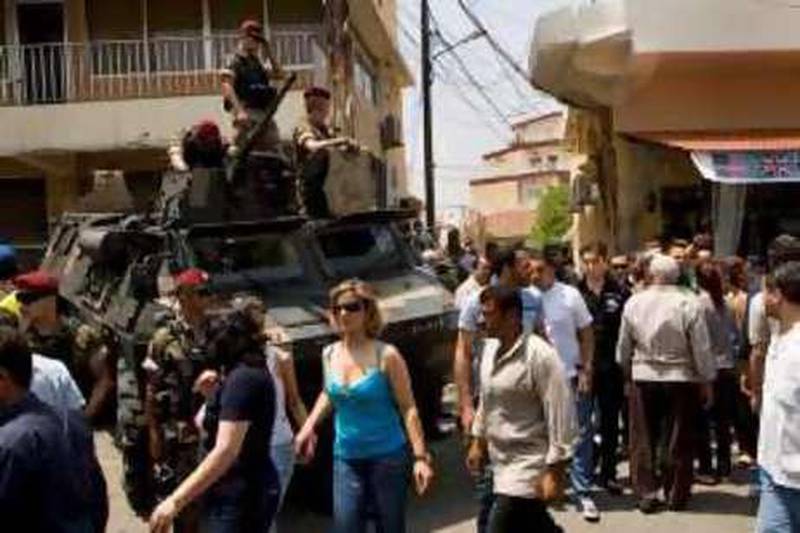 The predominately Christian city of Zgharta remained tense on Sunday after the murder of two men from a nearby village associated with the powerful Franjeih family by a political rival. ///Special Forces COmmandos from the Lebanese Army keep rivals away from Franjieh supporters during the voting to prevent bloodshed. 