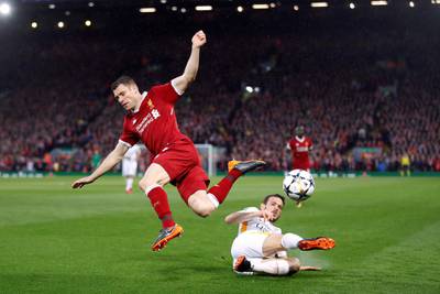 Roma's Alessandro Florenzi in action with Liverpool's James Milner. Carl Recine / Reuters