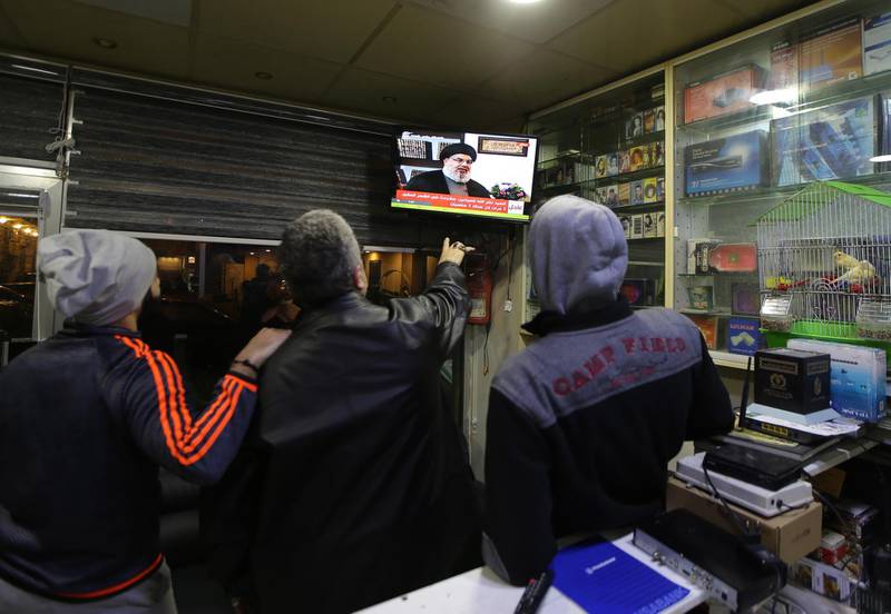 epa07322916 Lebanese men listen to Hezbollah leader Hassan Nasrallah during his TV interview on al-Mayadeen channel, in a shop in Beirut, Lebanon, 26 January 2019. According to reports, in the interview Nasrallah said that he is â€˜surprisedâ€™ that it took so long for Israel to discover the cross-border tunnels from Lebanon to Israel. Also Nasrallah spoke about the situation in Syria and about the American forces withdrawal from Syria.  EPA/NABIL MOUNZER