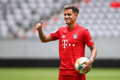Philippe Coutinho poses in a Bayern Munich strip at the club's Allianz Arena. Reuters