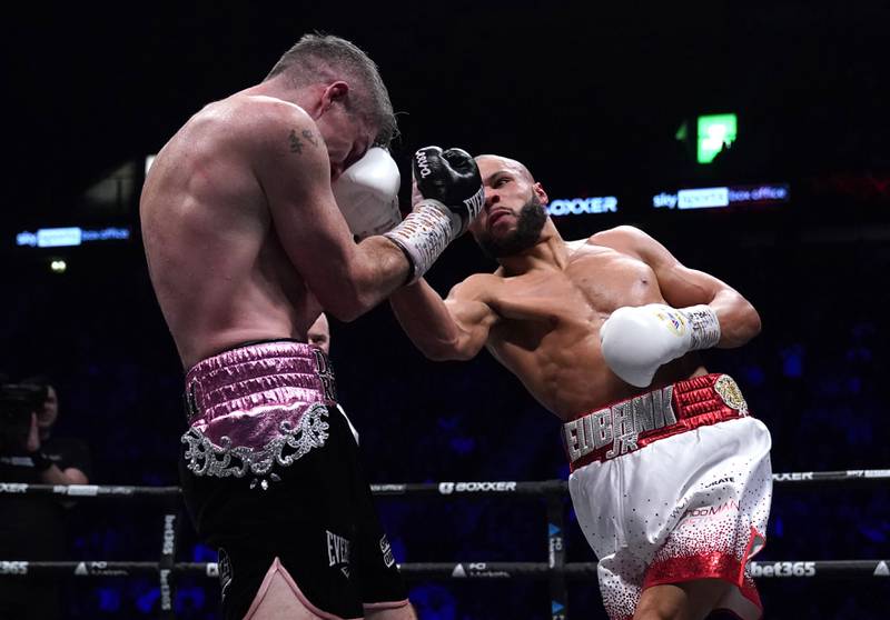 Chris Eubank Jr lands an uppercut on Liam Smith during their middleweight bout. PA