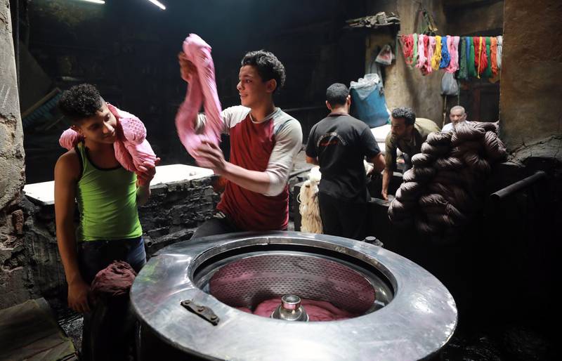To stay competitive Salama uses firewood instead of fuel to heat the colour baths. EPA / Khaled Elfiqi