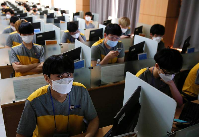 South Korean young men wear masks to protect against the new coronavirus as they take part in a conscription examination for the national service in Seoul, South Korea. Reuters