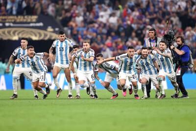 Argentina players celebrate Gonzalo Montiel's World Cup-winning penalty. Getty Images