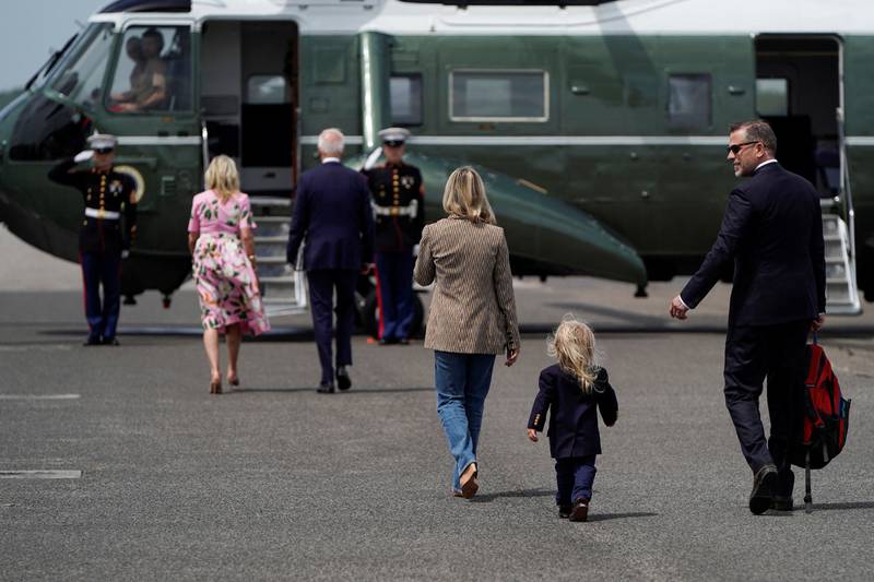 Hunter Biden, his wife Melissa Cohen and their son Beau follow the presidential couple as they board Marine One at Joint Base Charleston, South Carolina. Reuters