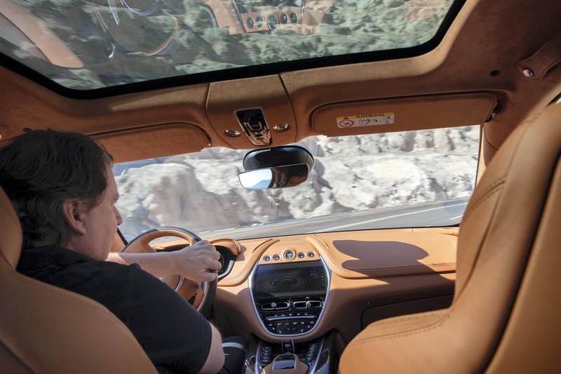 A 10.25-inch TFT infotainment display lies in the centre console of the Aston Martin DBX and is operated via rotary buttons.
